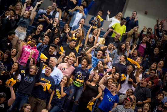 Large Group of Students Cheering Wildly in a Sports Arena 