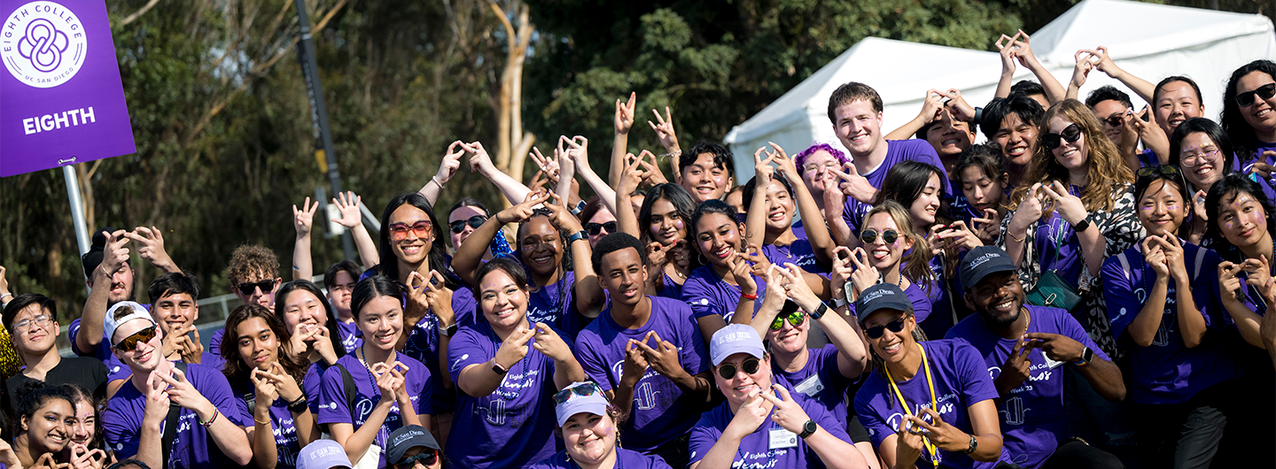 Inaugural class of Eighth students and staff standing in a crowd and smiling